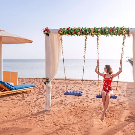 Pickalbatros Laguna Club Resort Sharm El Sheikh Exterior photo A swing at the beach